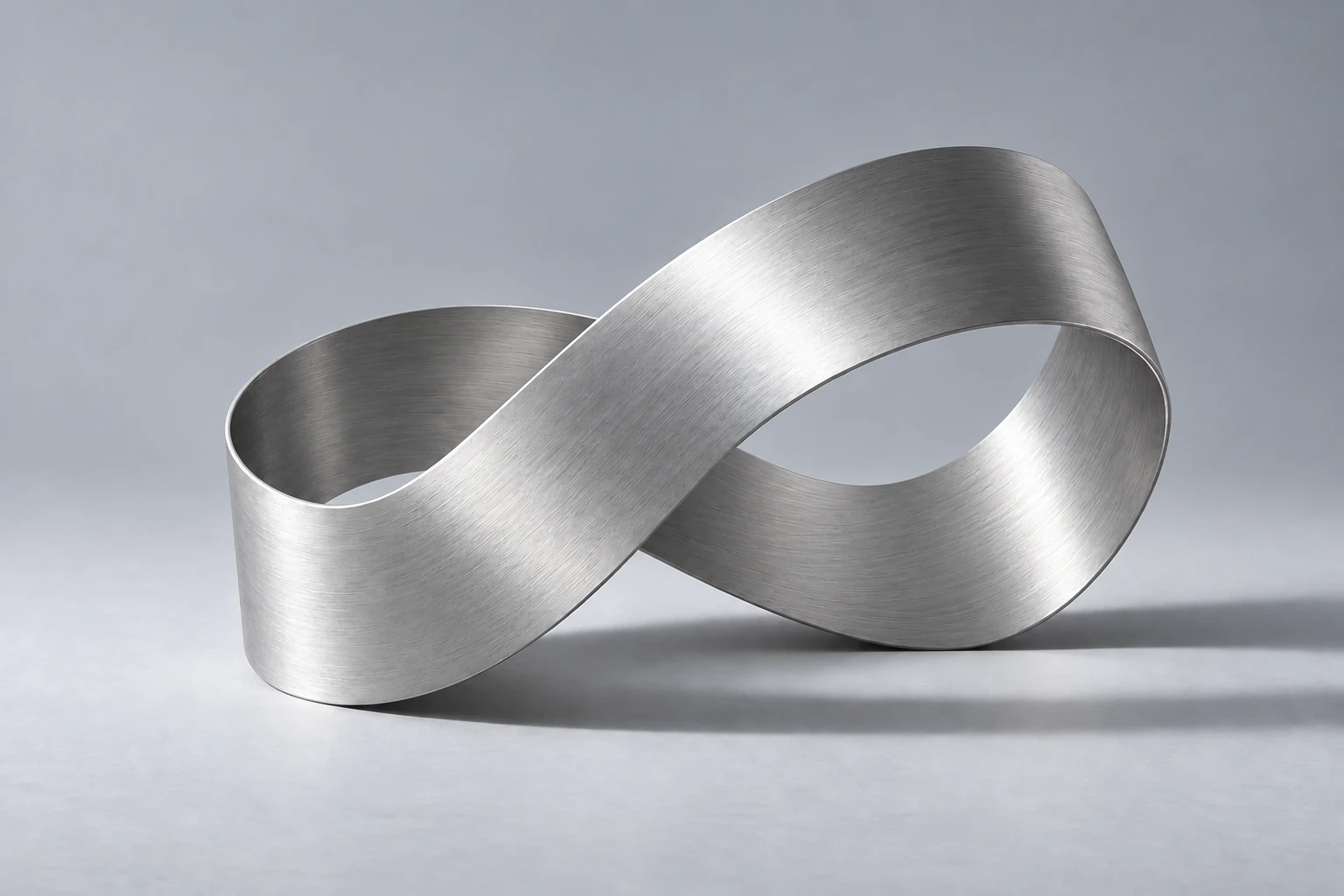 A silver ribbon folded into an open loop